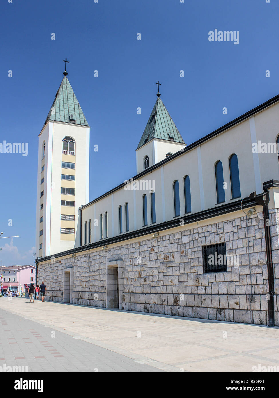 Medjugorje August 2013. Side view of St James church & it's twin steeples. Stock Photo