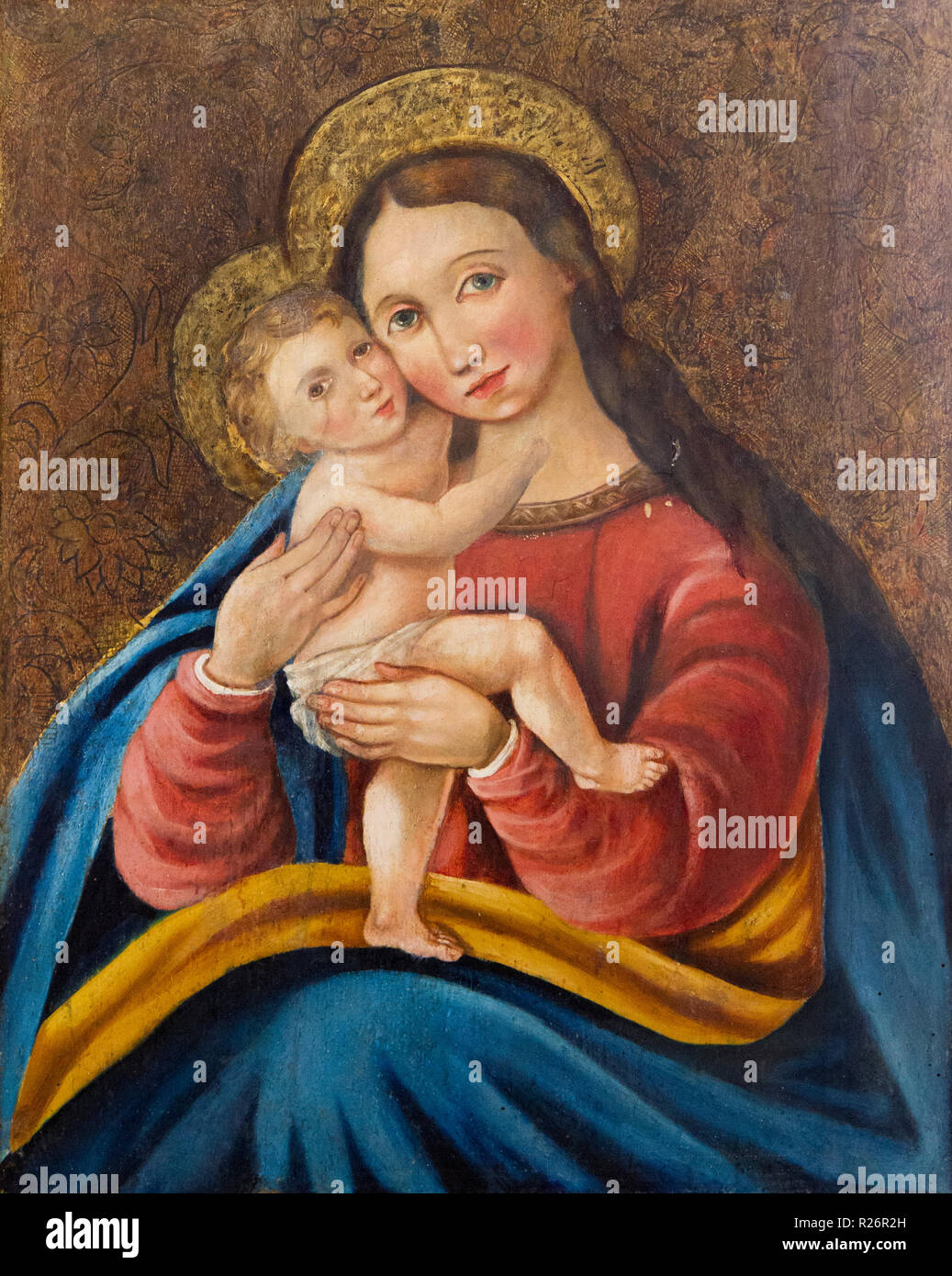 An icon of Virgin Eleusa (or Eleousa) (Greek: tenderness or showing mercy) - Virgin of Tenderness from a church in Bardejov. Author: Mojs Zomph, 1860. Stock Photo