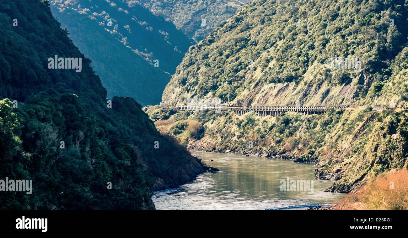 Landscape image of the Manawatu Gorge taken on it's last operational day. The gorge was closed permanently after landslides made it unsafe for travel. Stock Photo