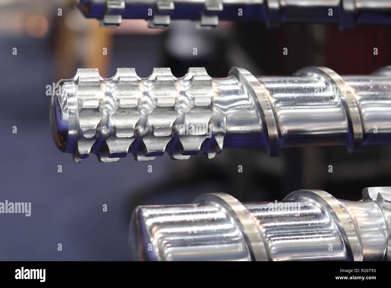 Screw press parts for plastic injection machine ; selective focus Stock Photo