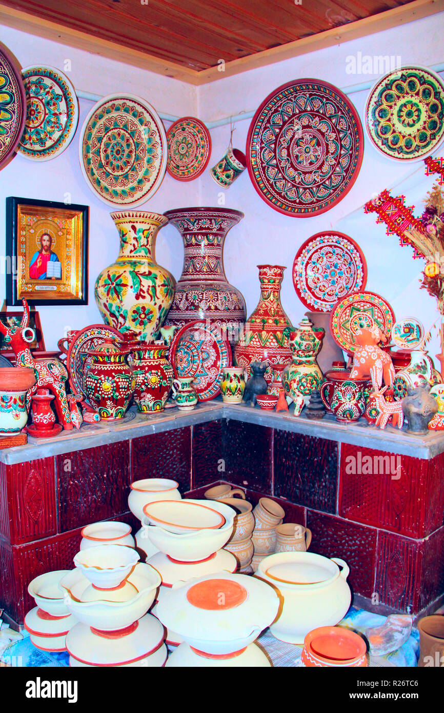 A wide choice of ceramic products on shelf of store. Pottery for sale. Ceramic goods. Products of ceramics on sale Stock Photo