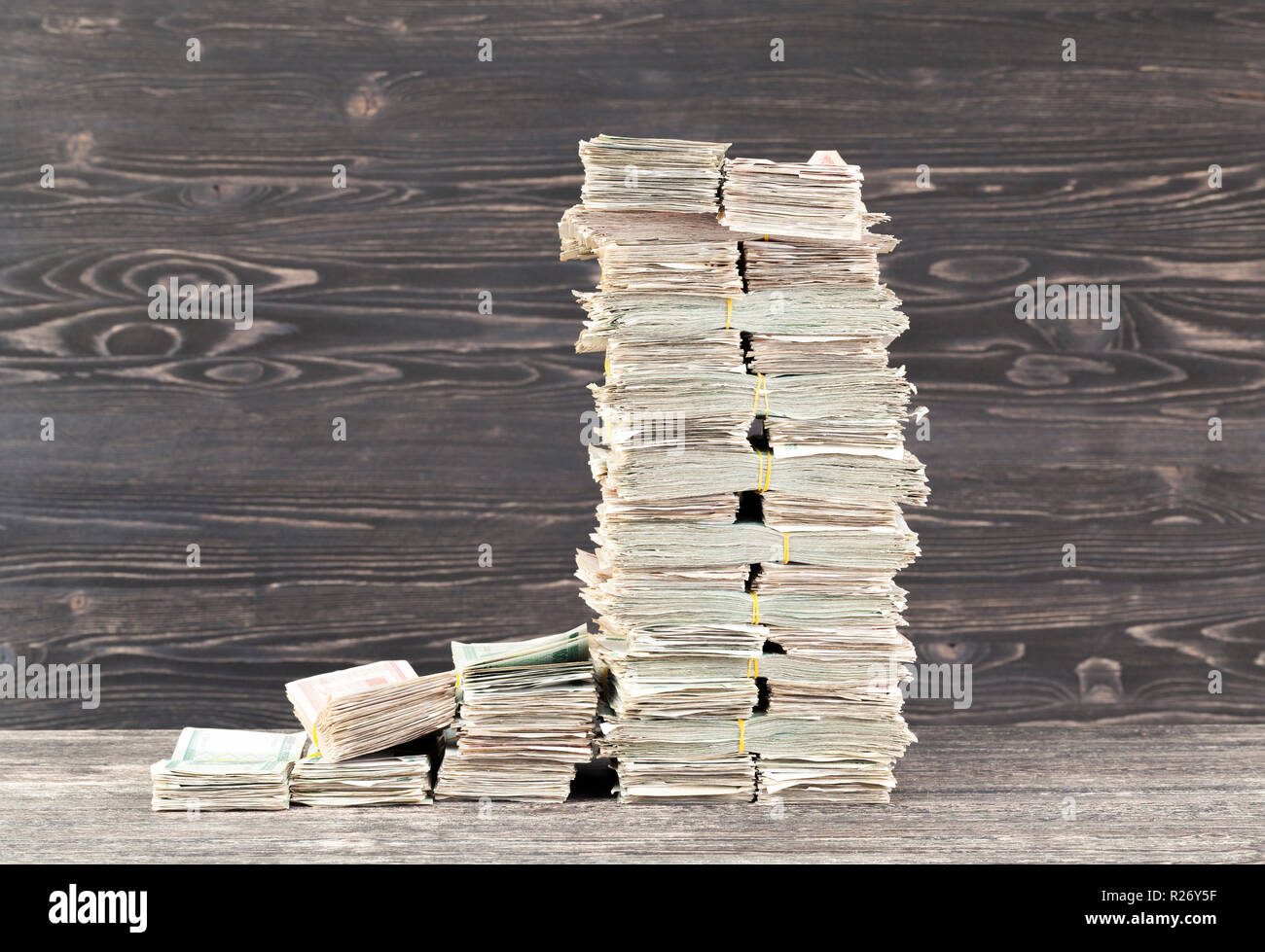 a lot of paper cash lays together in a big pile Stock Photo