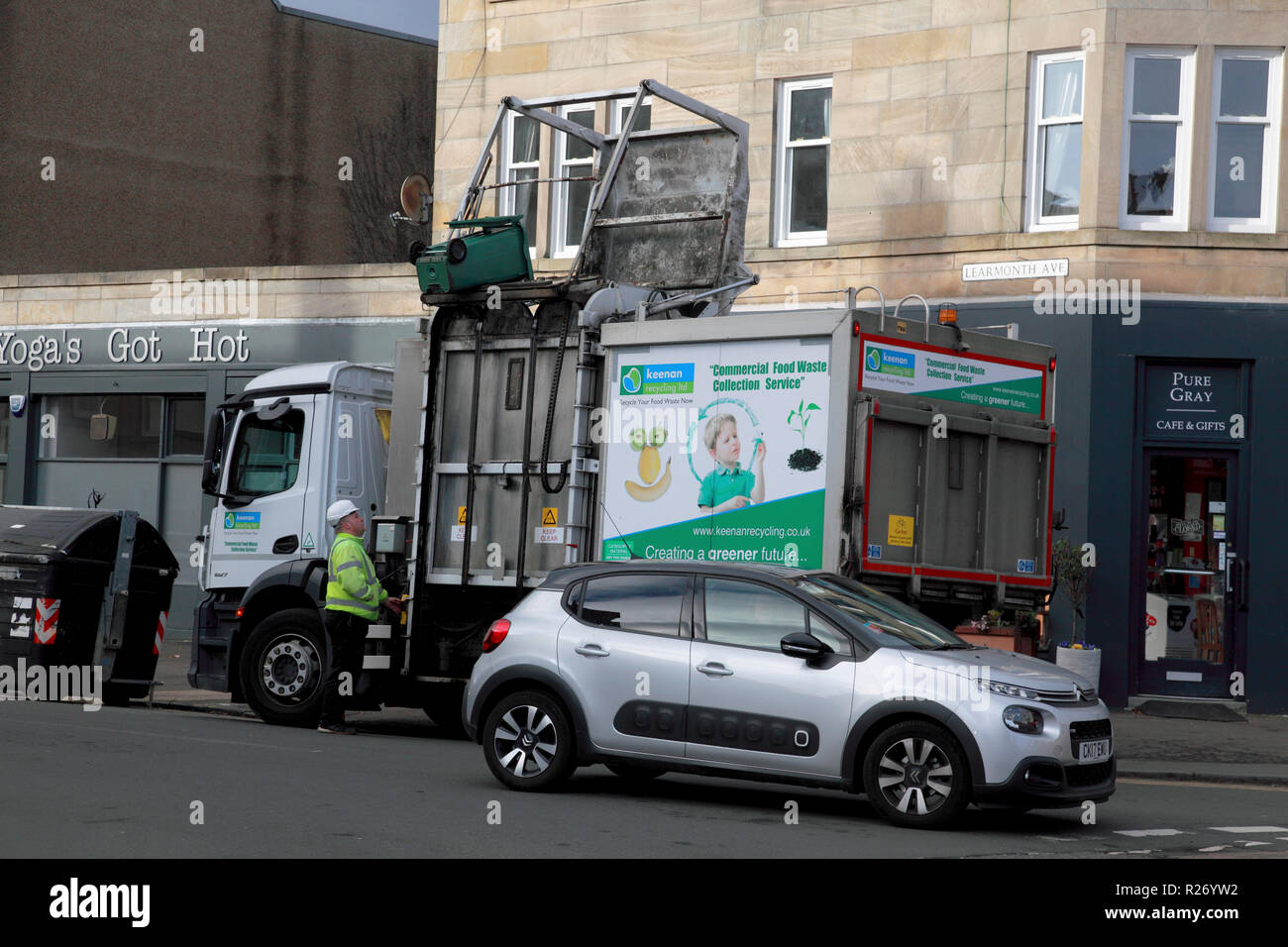 A green bin about to empty its contents into a bin lorry owned by Keenan Commercial Food Waste Collection Service Stock Photo