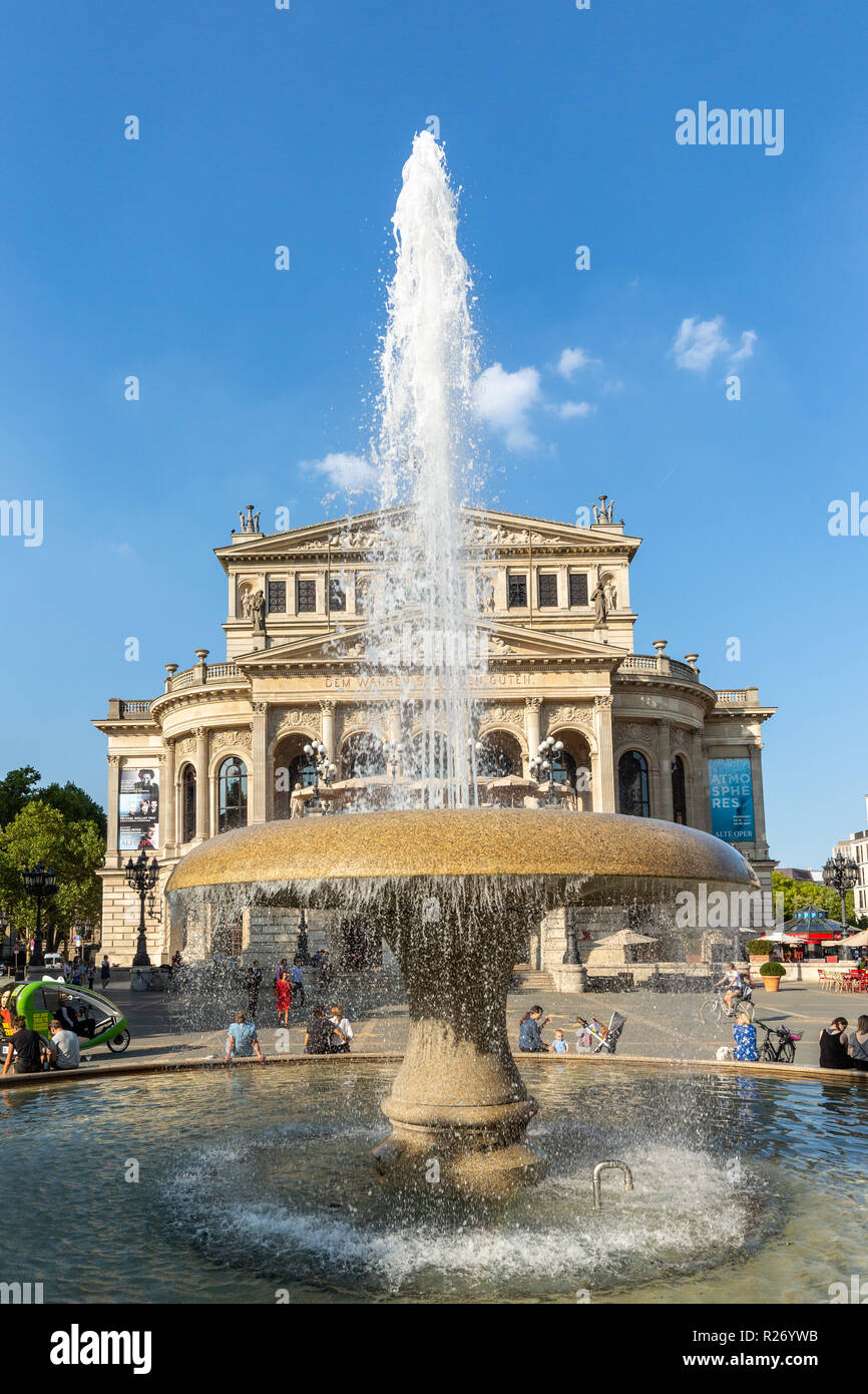 Frankfurt -  Germany, September, 5th, 2018 - the Old Opera House Alte Oper in Frankfurt Main in summer with Opernplatz fountain and walking people. Stock Photo