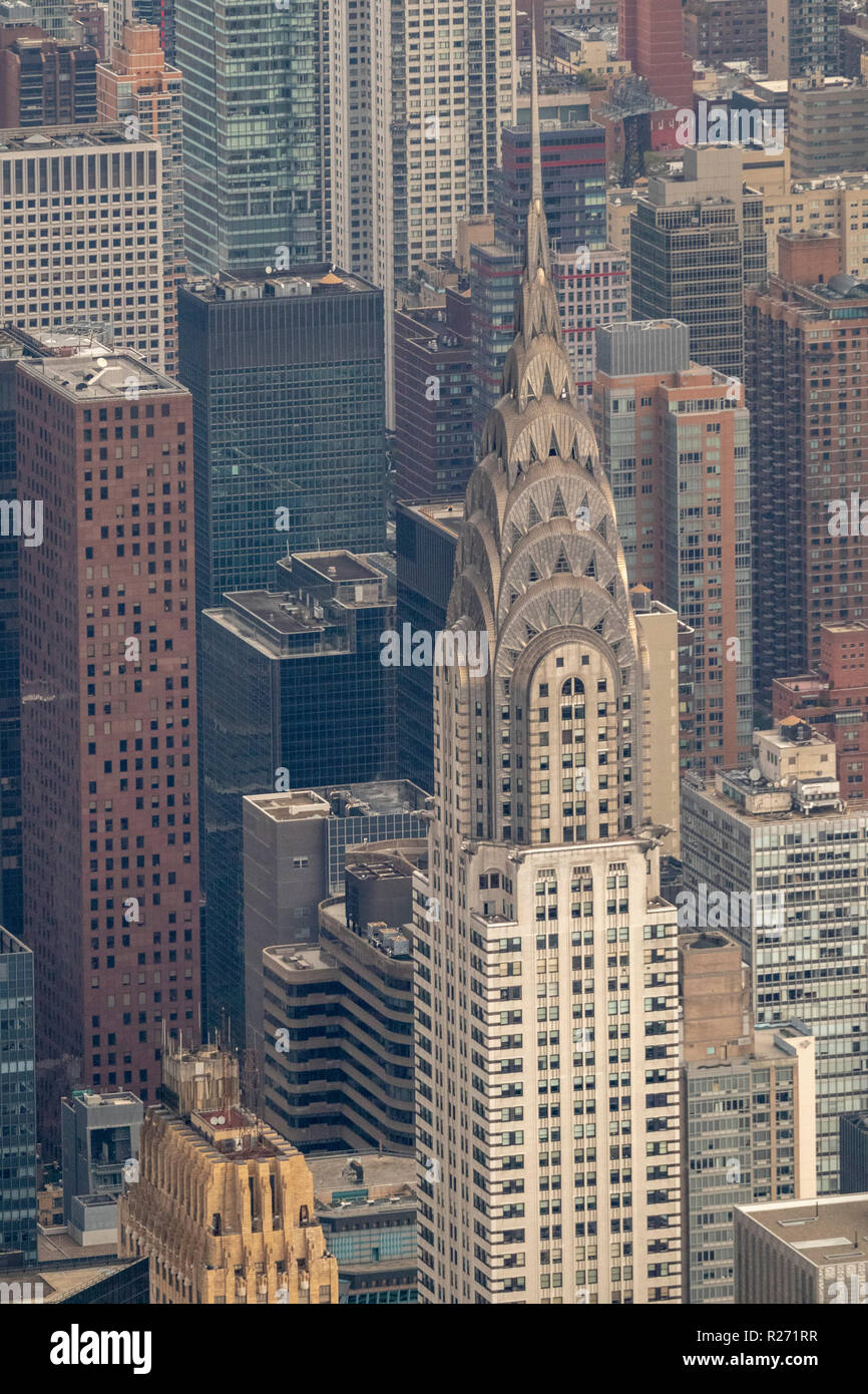 helicopter aerial view of the top of the Chrysler Building and nearby buildings, an Art Deco–style skyscraper, Manhattan, New York, USA Stock Photo