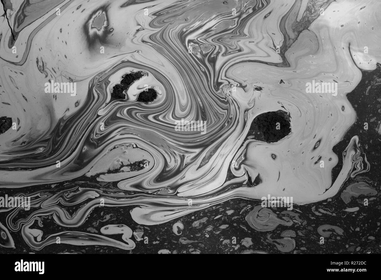 Abstract fluid shapes tar water reflections background. Black and white. Stock Photo
