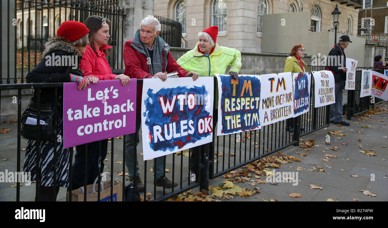 Pro- Brexit protesters are seen holding placards during the protest at Downing Street. A few Brexit supporters gathered in front of Downing Street together with their Pro Brexit placards to show their support to the Conservative government led by Theresa May for the negotiations carried out between the UK and the European Union over Brexit terms. Stock Photo