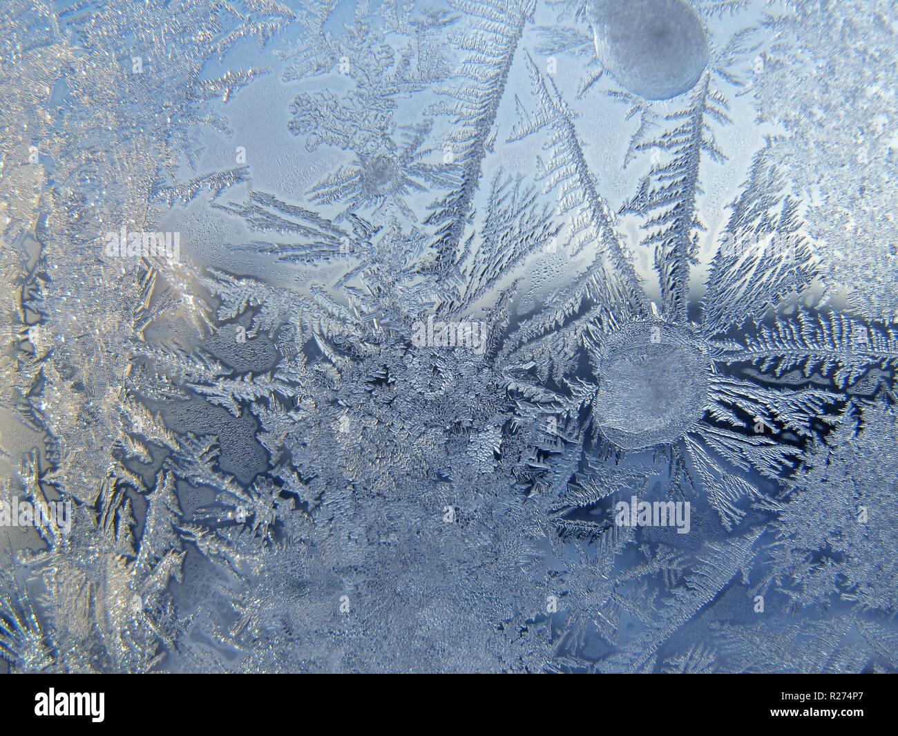 frosty natural pattern and sunlight on winter window Stock Photo - Alamy
