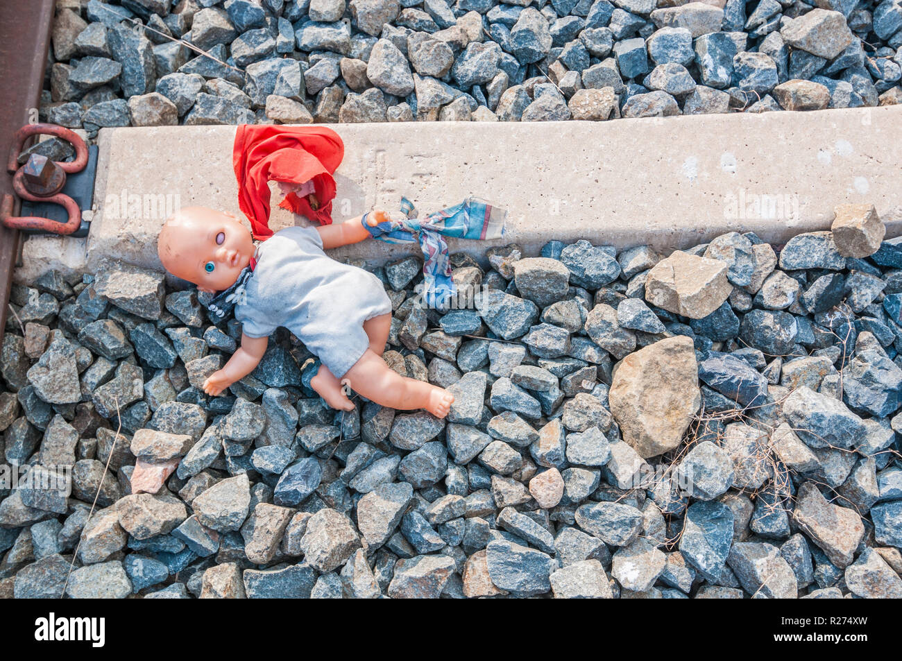 broken plastic doll in the railway Stock Photo