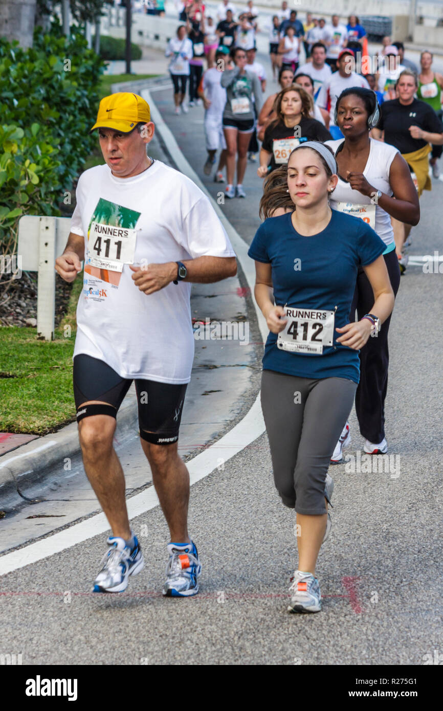 Miami Beach Florida,Blue Cross & Blue Shield Tropical 5K Run,race,runner,endurance,sports,fitness,road race,competition,athlete,bib number,man men mal Stock Photo