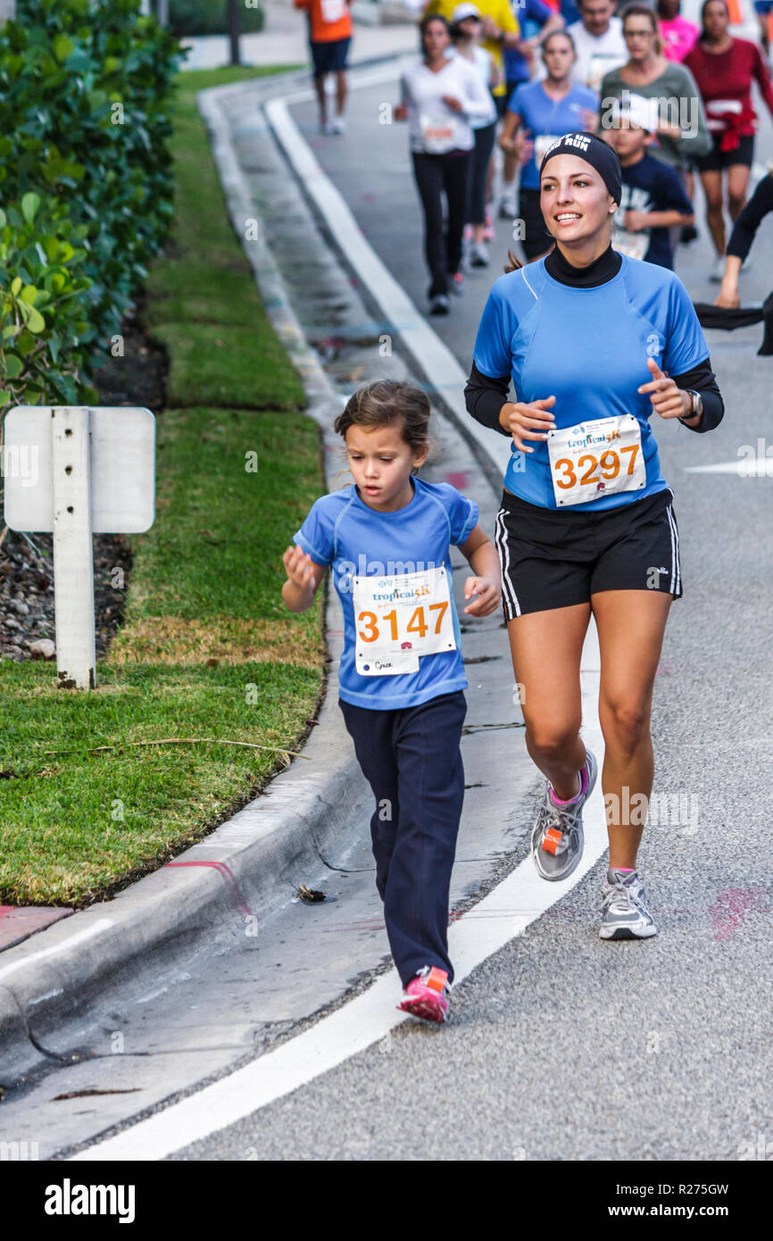 Miami Beach Florida,Blue Cross & Blue Shield Tropical 5K Run,race,runner,endurance,sports,fitness,Hispanic woman female women,girl girls,youngster,kid Stock Photo