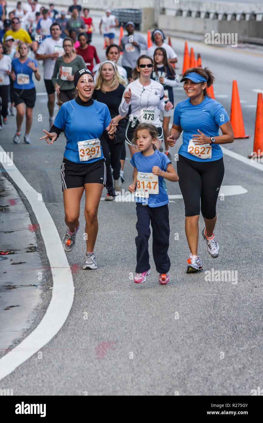 Miami Beach Florida,Blue Cross & Blue Shield Tropical 5K Run,race,runner,endurance,sports,fitness,Hispanic woman female women,girl girls,youngster,fem Stock Photo
