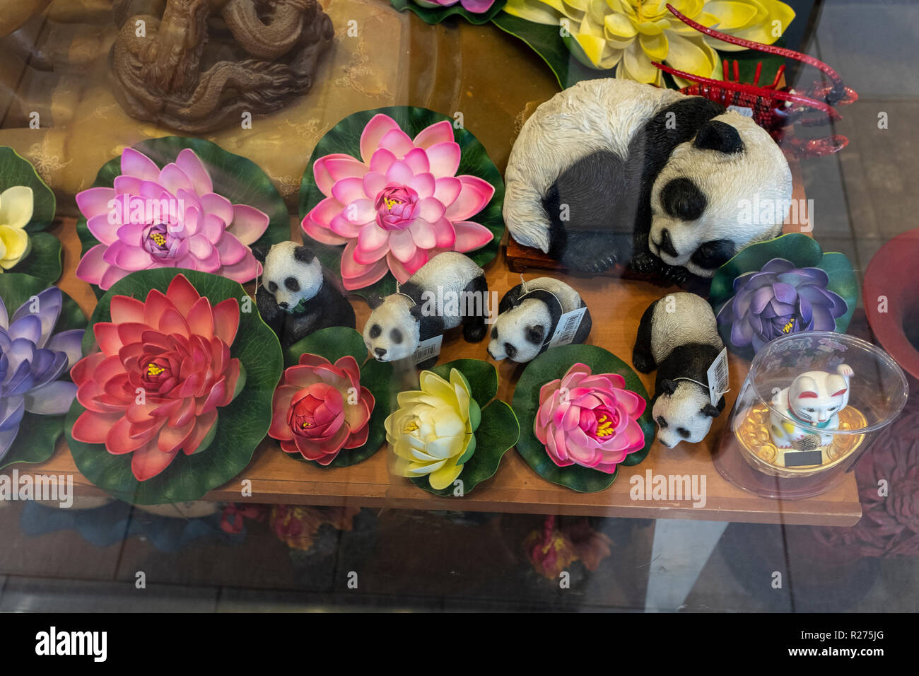 Chinese lotus flowers & other good luck talisman in window display