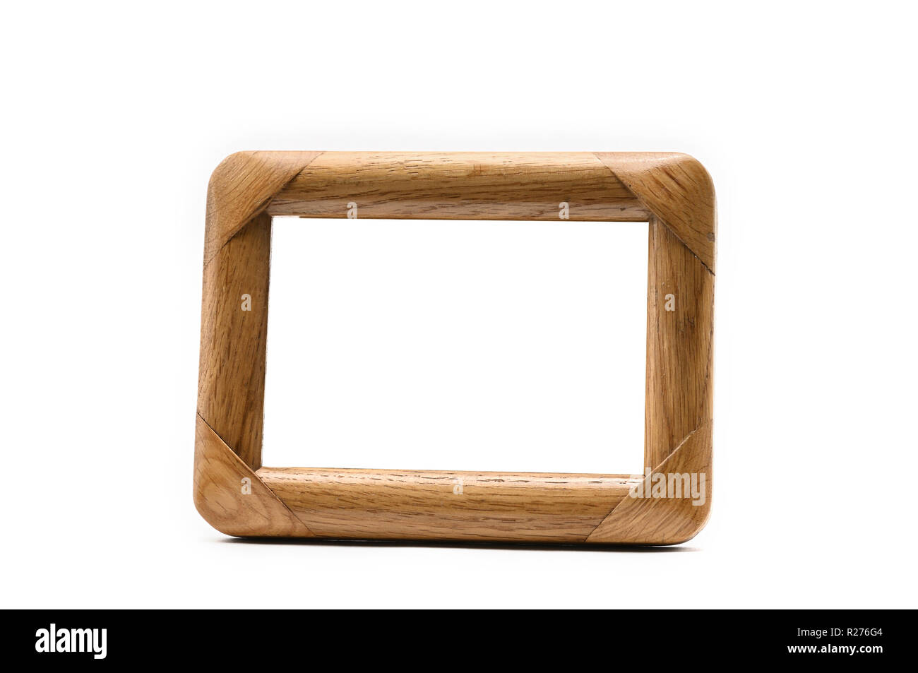 Vintage wooden photo frame on an isolated white background Stock Photo