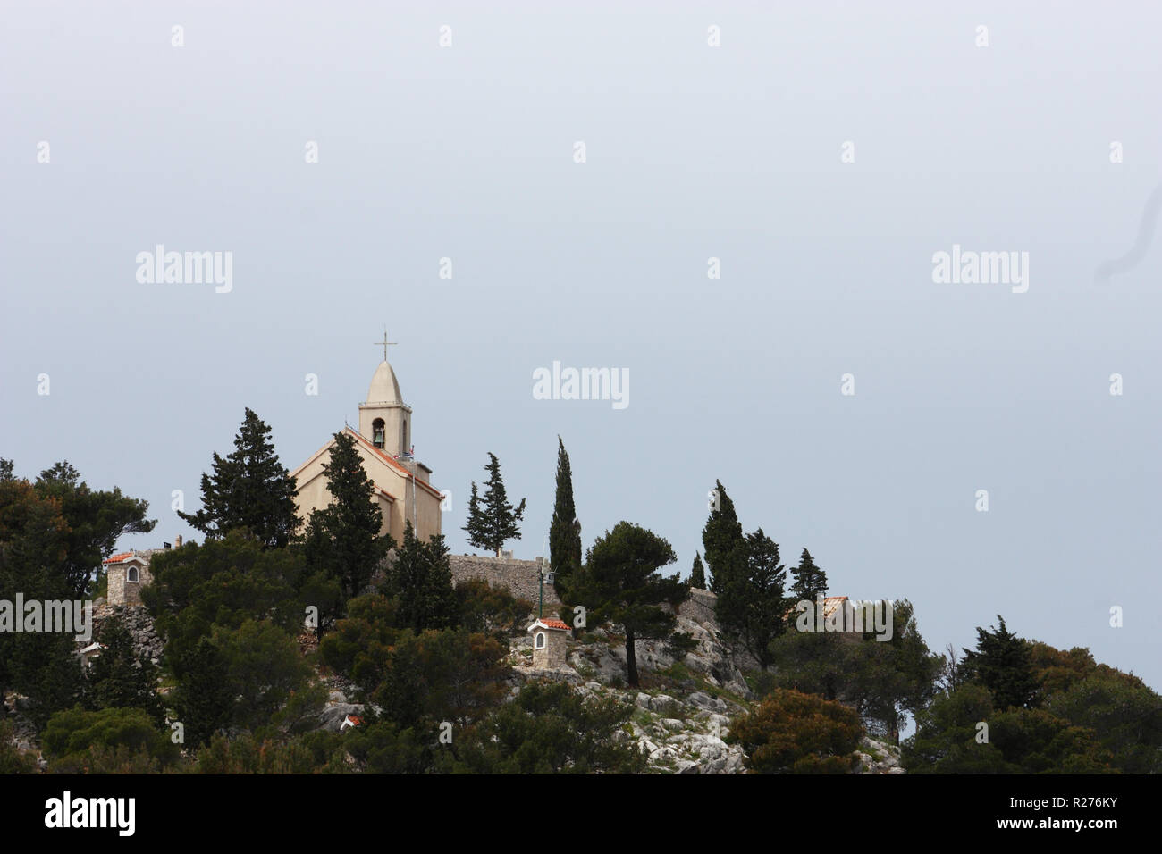 A small church on top of the hill on Mediterranean coast, Tribunj, Croatia Stock Photo