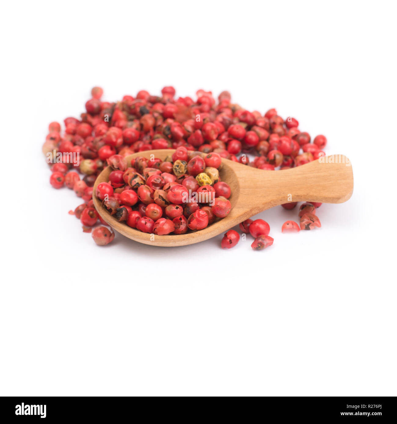 pink peppercorns isolated on white background, dried berries of
