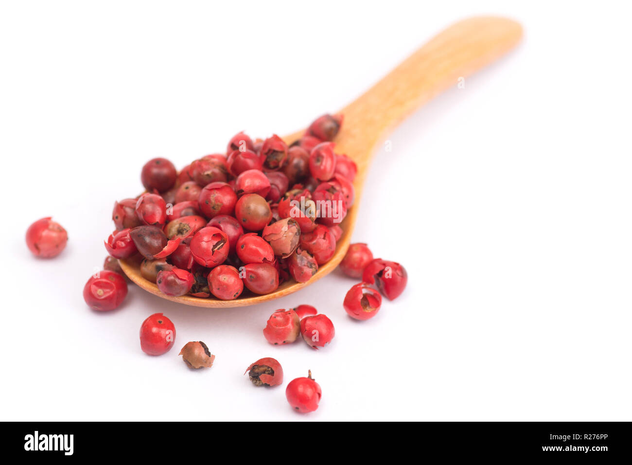 pink peppercorns isolated on white background, dried berries of