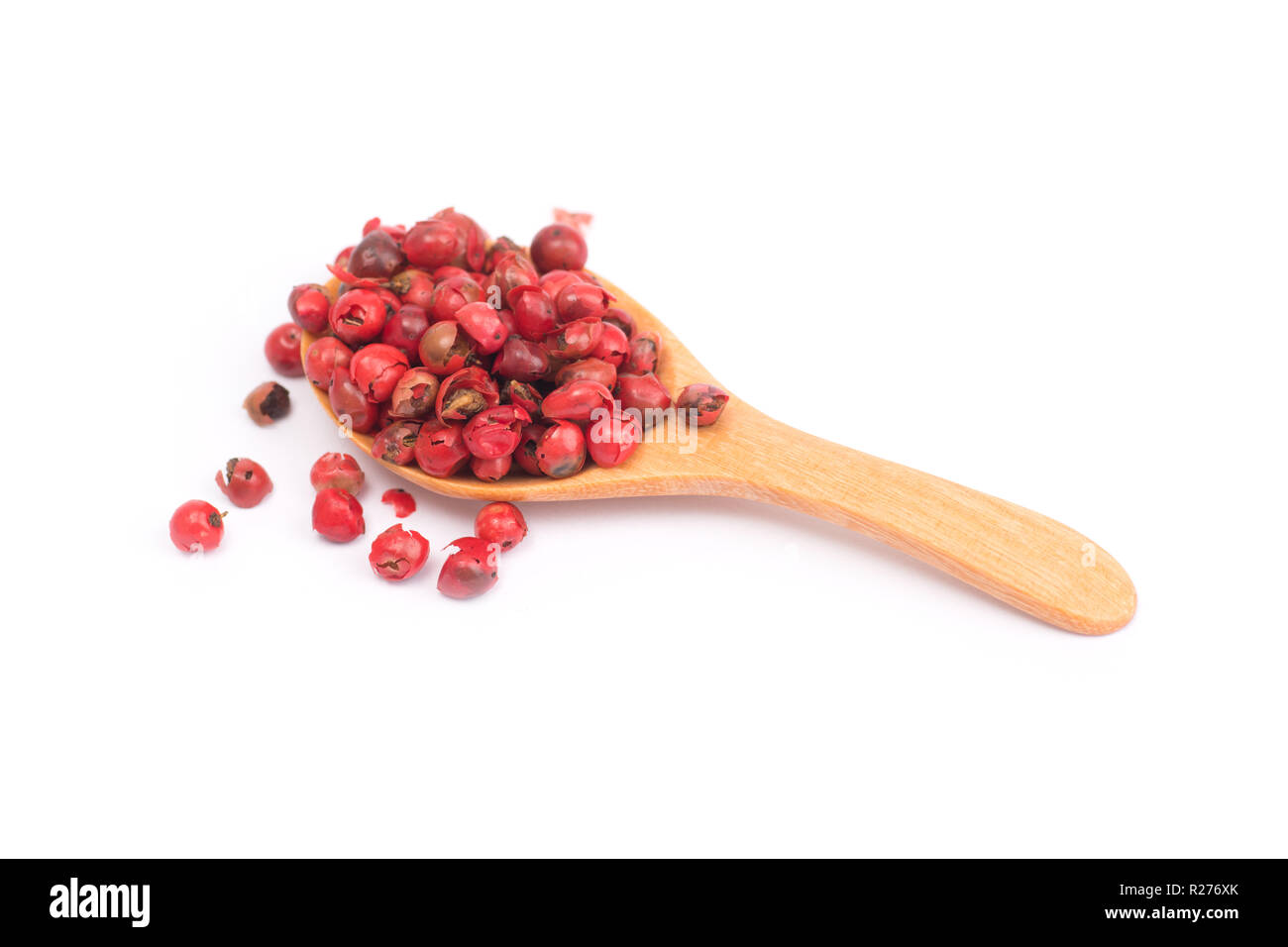 pink peppercorns isolated on white background, dried berries of