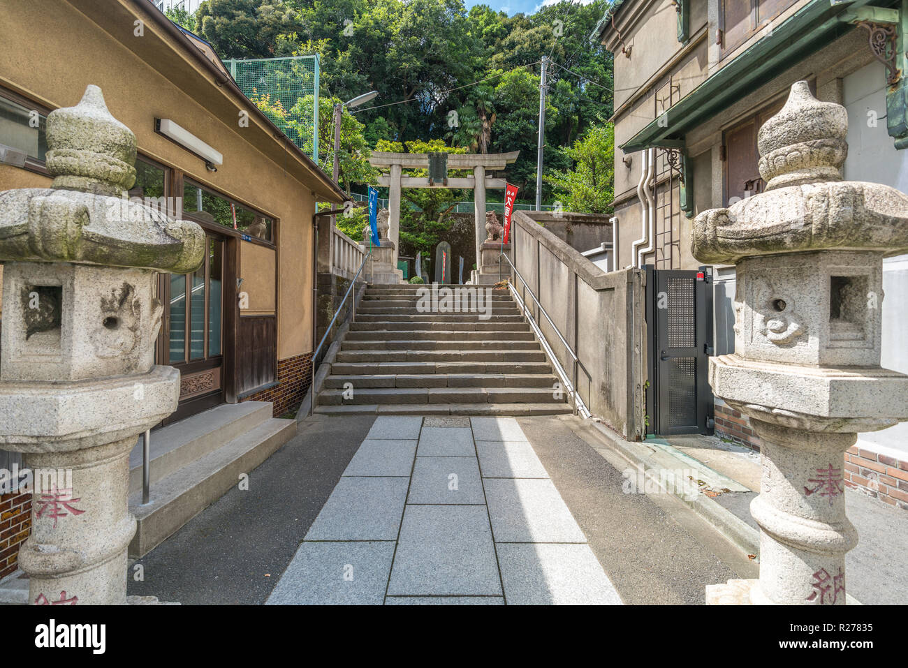 Tokyo, Minato Ward - August 14, 2018 : Outer entrance of Hisakuni Jinja Shinto Shrine devoted to Hotei-son god of happiness and prosperity. Located in Stock Photo