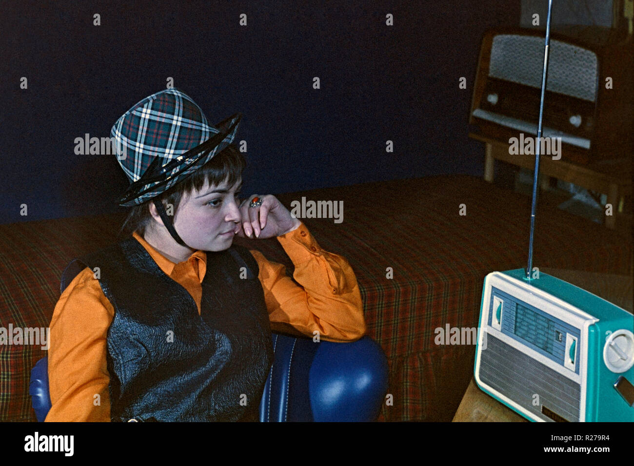 Listening to radio 1960s hi-res stock photography and images