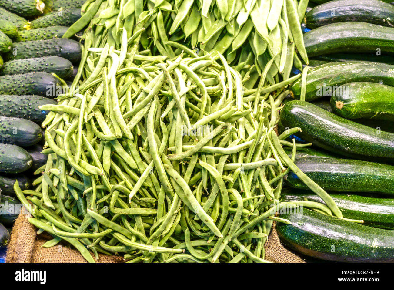 Fresh pea pods on a vegetable market stall, Alicante Spain Stock Photo