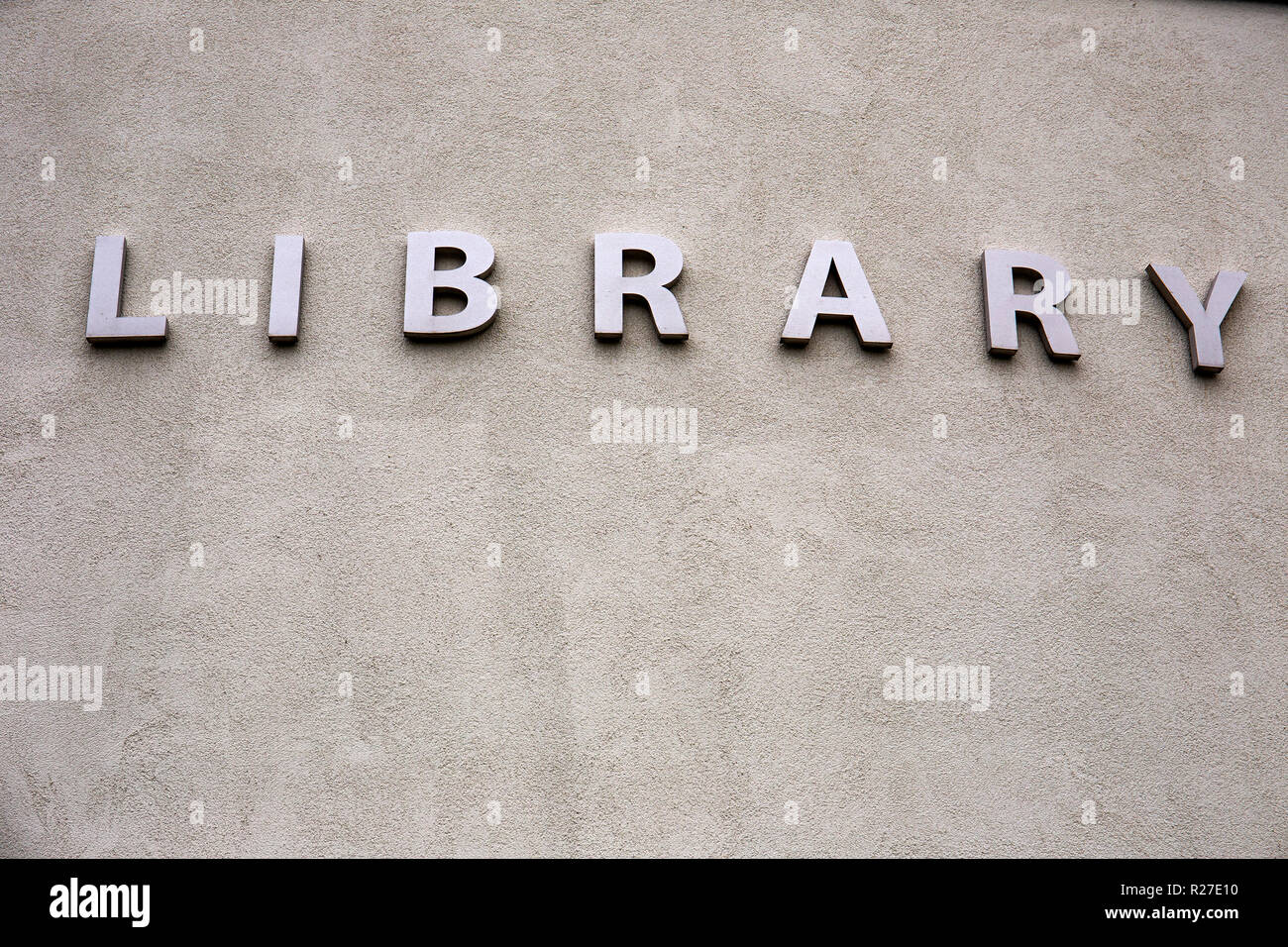Library sign on outside wall UK Stock Photo