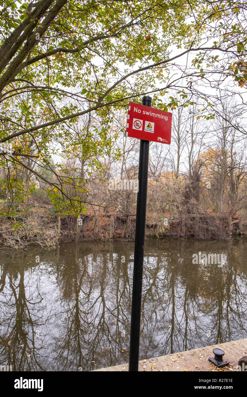 No swimming sign on the banks of the river weaver in Winsford Cheshire UK Stock Photo