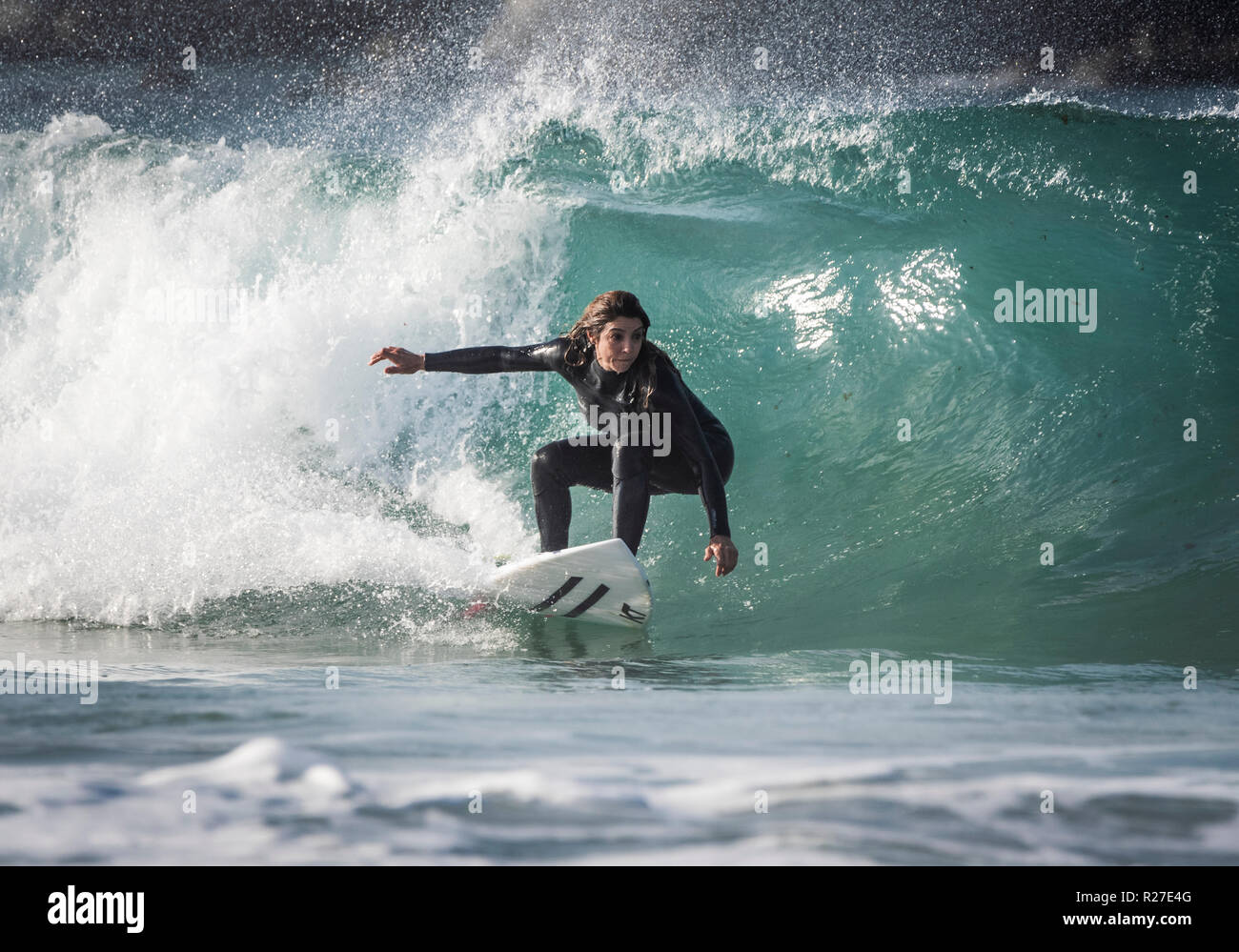 Woman surfer in action. Stock Photo