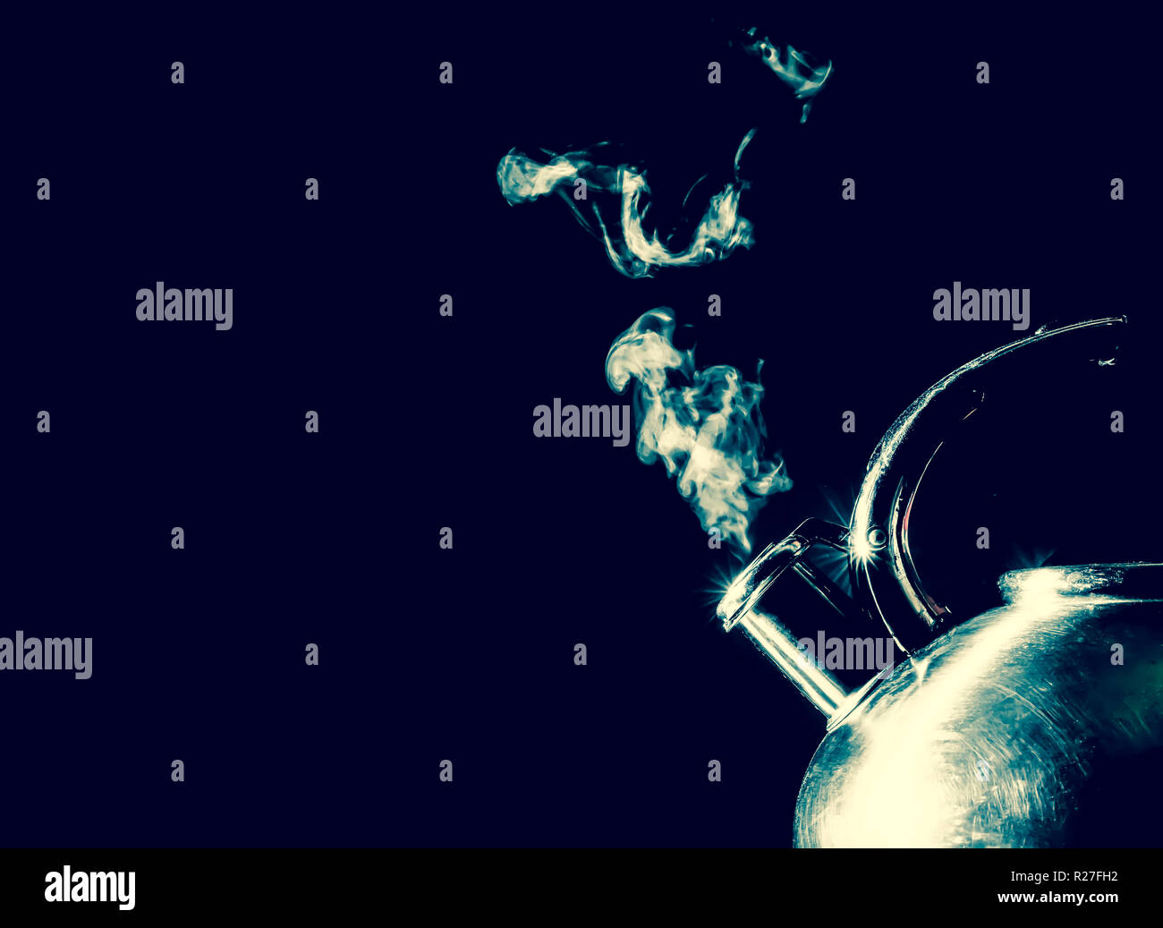 Kettle whistling, boiling kettle with steam texture on a black background. Vintage, grunge old