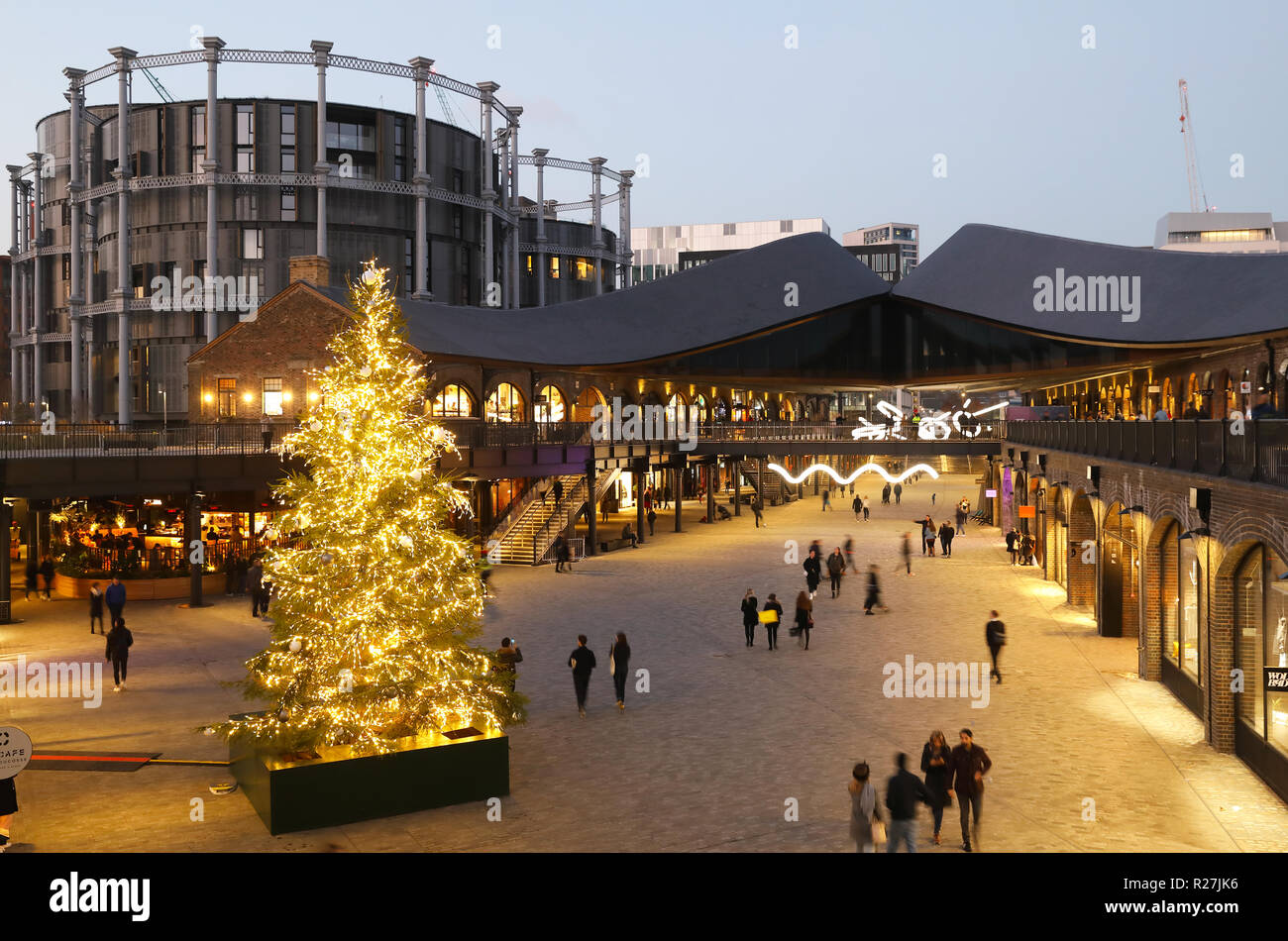 Christmas tree in Coal Drops Yard piazza, at KIngs Cross, in London, UK