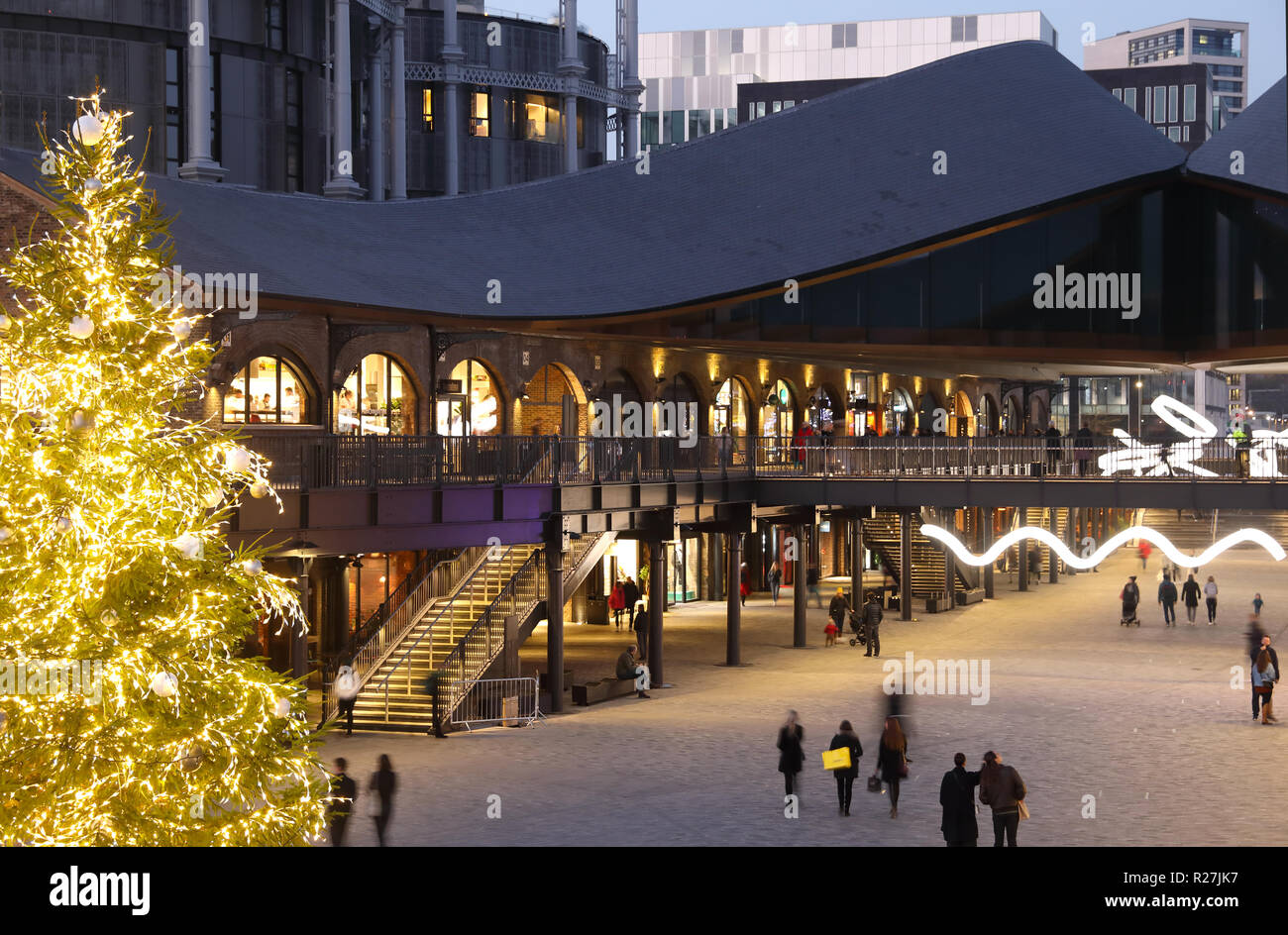 Christmas tree in Coal Drops Yard piazza, at KIngs Cross, in London, UK