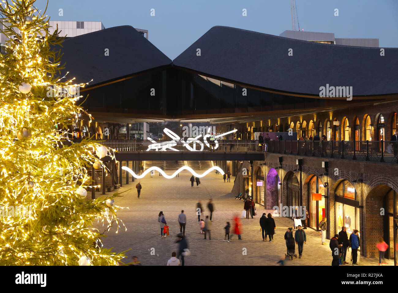 Christmas tree in Coal Drops Yard piazza, at KIngs Cross, in London, UK
