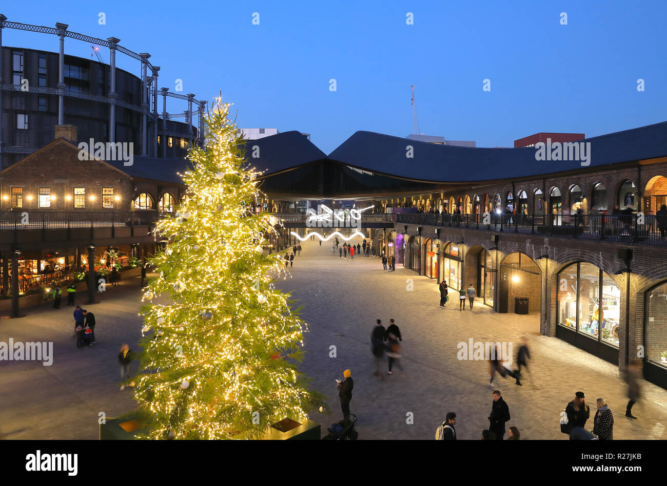 Christmas tree in Coal Drops Yard piazza, at KIngs Cross, in London, UK
