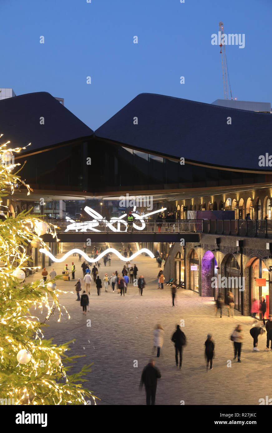 Christmas tree in Coal Drops Yard piazza, at KIngs Cross, in London, UK