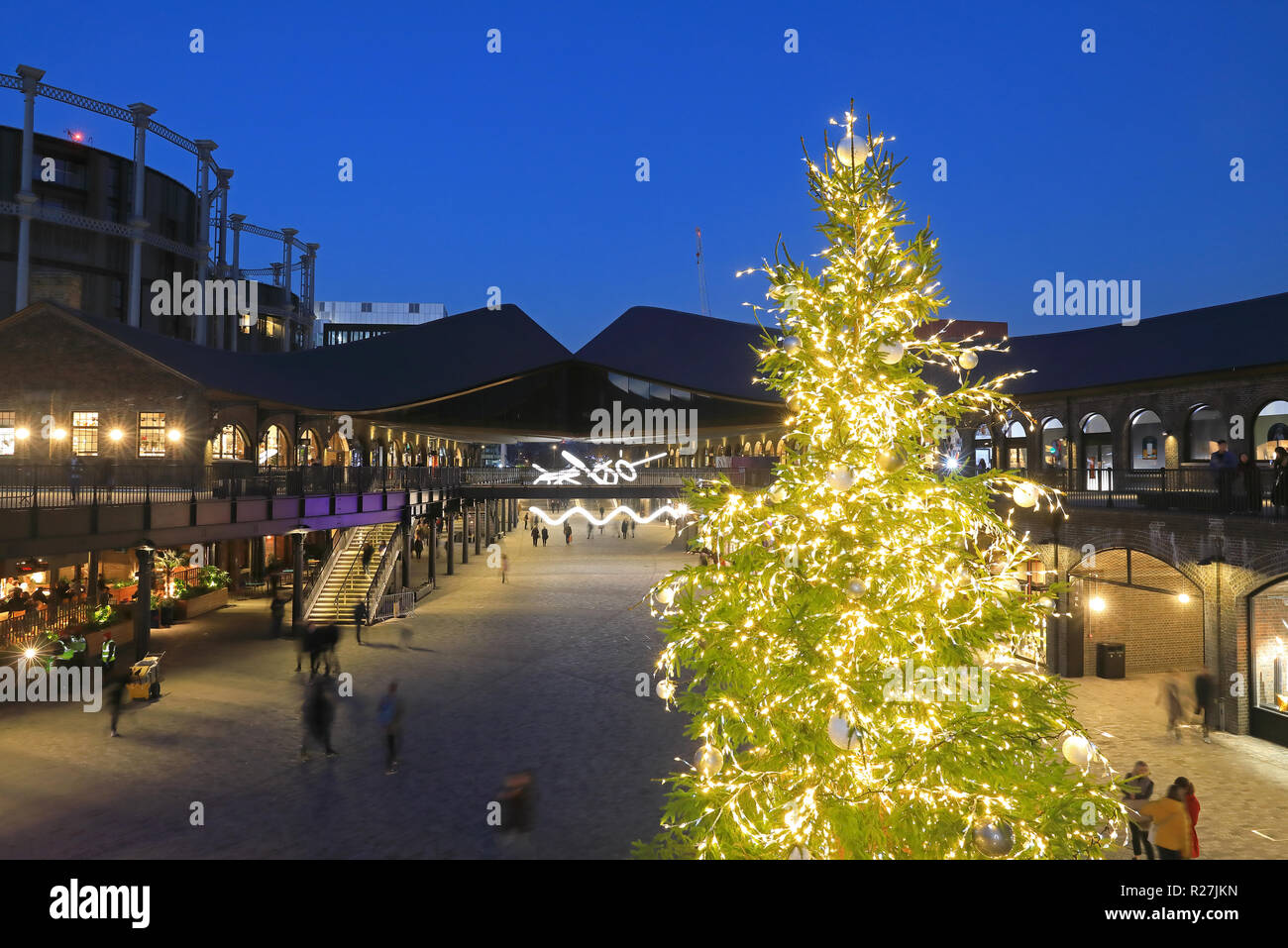 Christmas tree in Coal Drops Yard piazza, at KIngs Cross, in London, UK