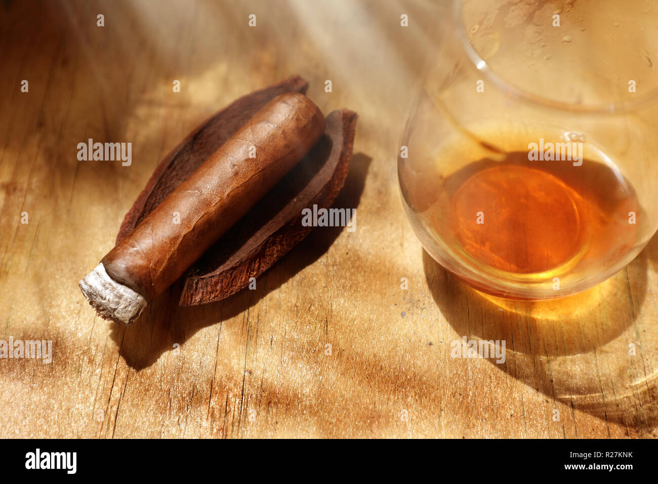 Close up cigar and drink on wooden table Stock Photo
