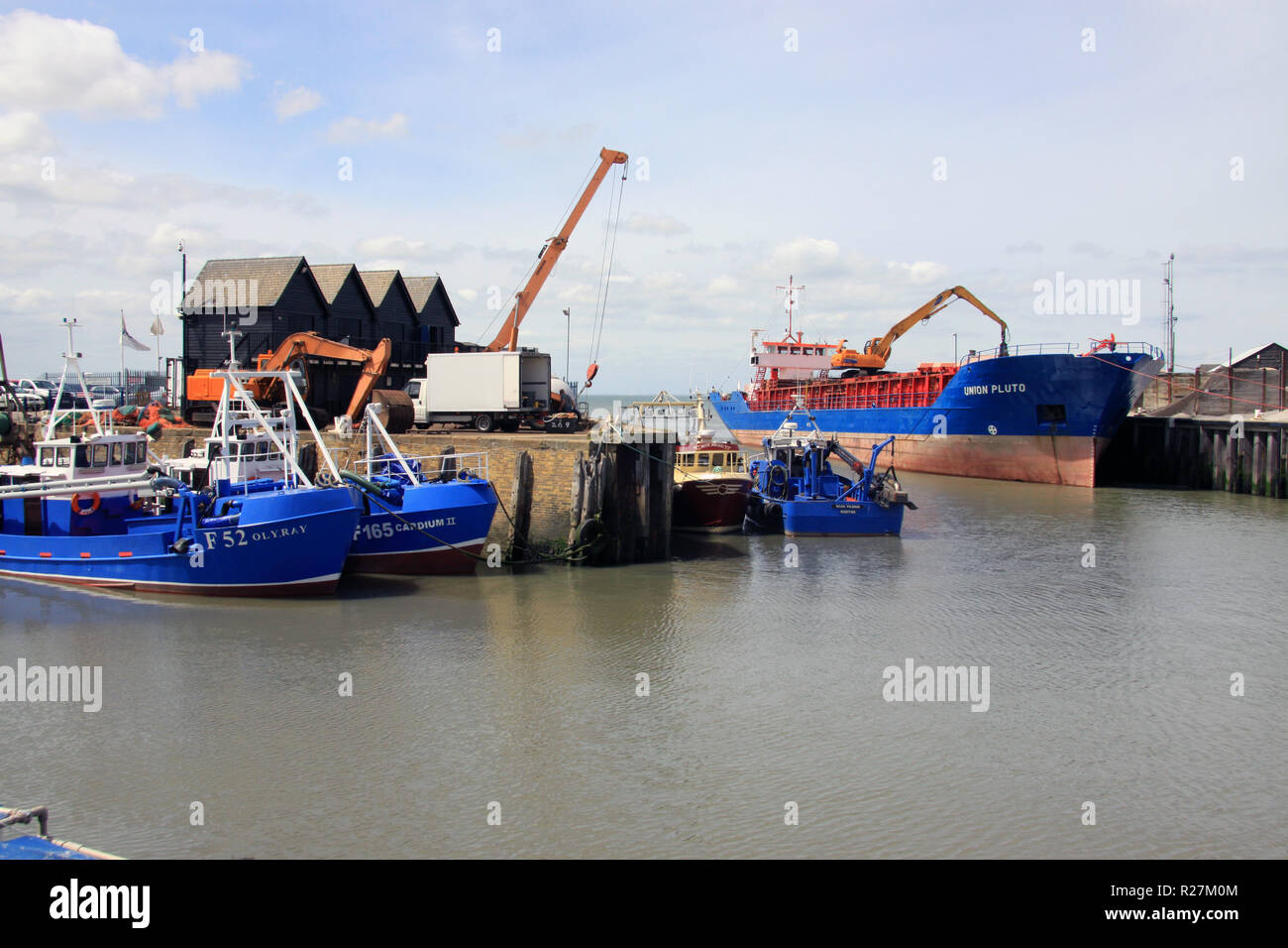 Fishing boats in the harbour at the Kent resort of Whitstable  a seaside town on the north coast of Kent England UK Stock Photo