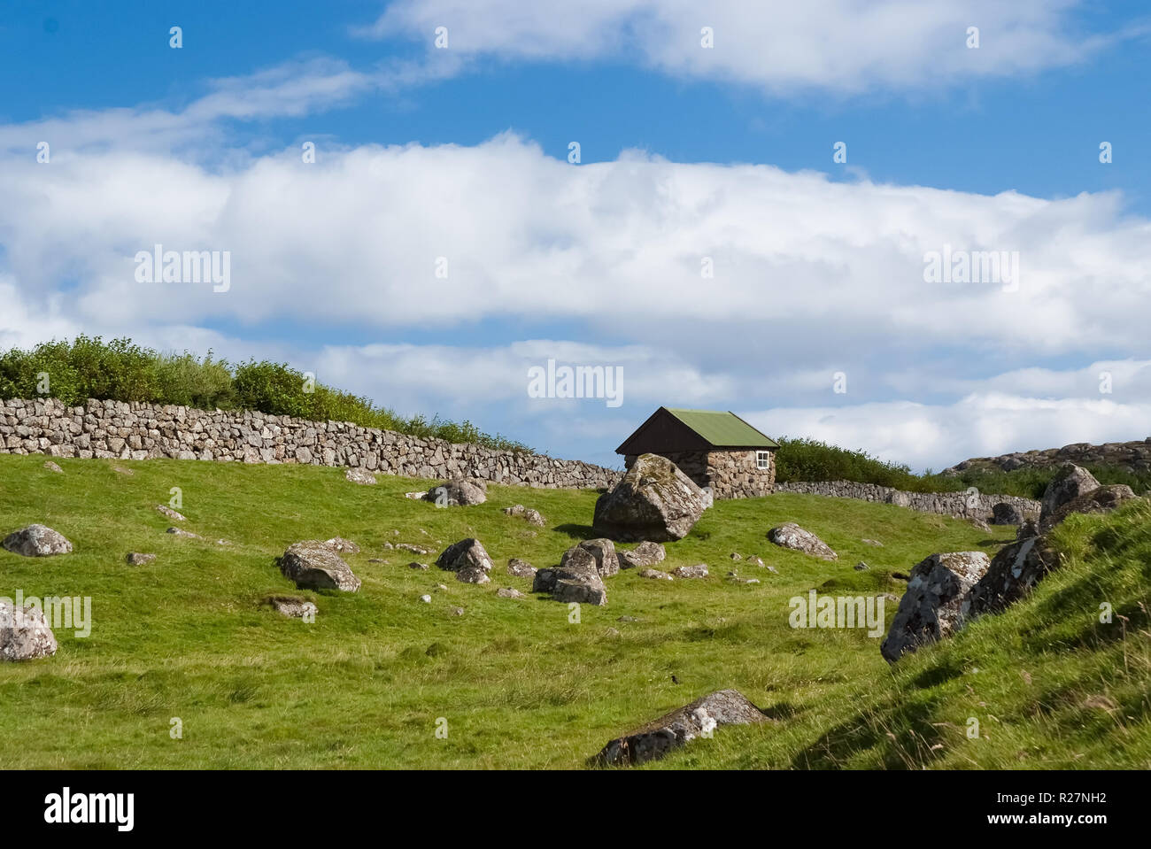 indbildskhed Memo Faldgruber Farmhouse in Torshavn, Denmark. Old stone house in farm yard on cloudy blue  sky. Typical rural architecture. Nature and environment. Beautiful  landscape view. Summer vacation in country Stock Photo - Alamy