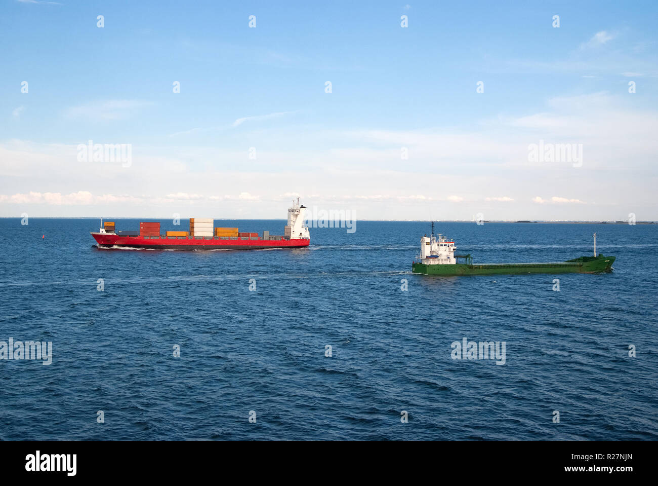 Barges ship cargo containers in sea in Copenhagen, Denmark. Cargo ships