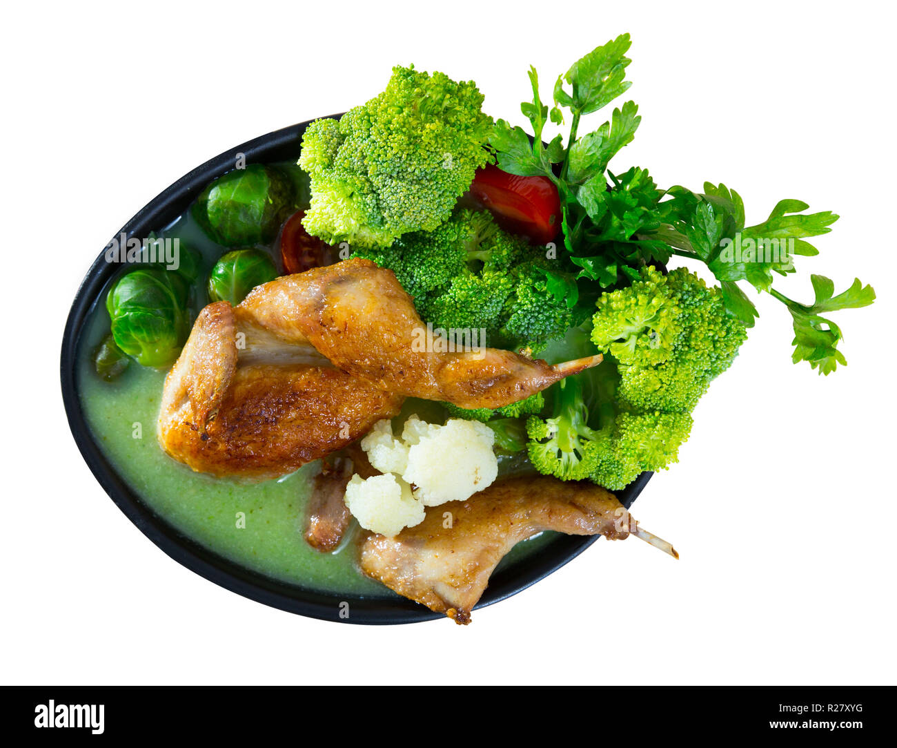 Cream soup boiled with quail, served with broccoli, brussels sprouts