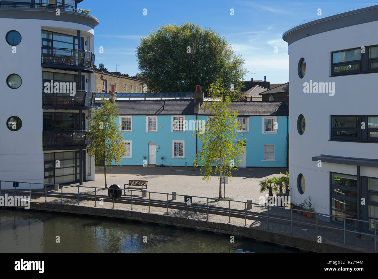 Old restored cottages and modern canal side apartments Camden Town
