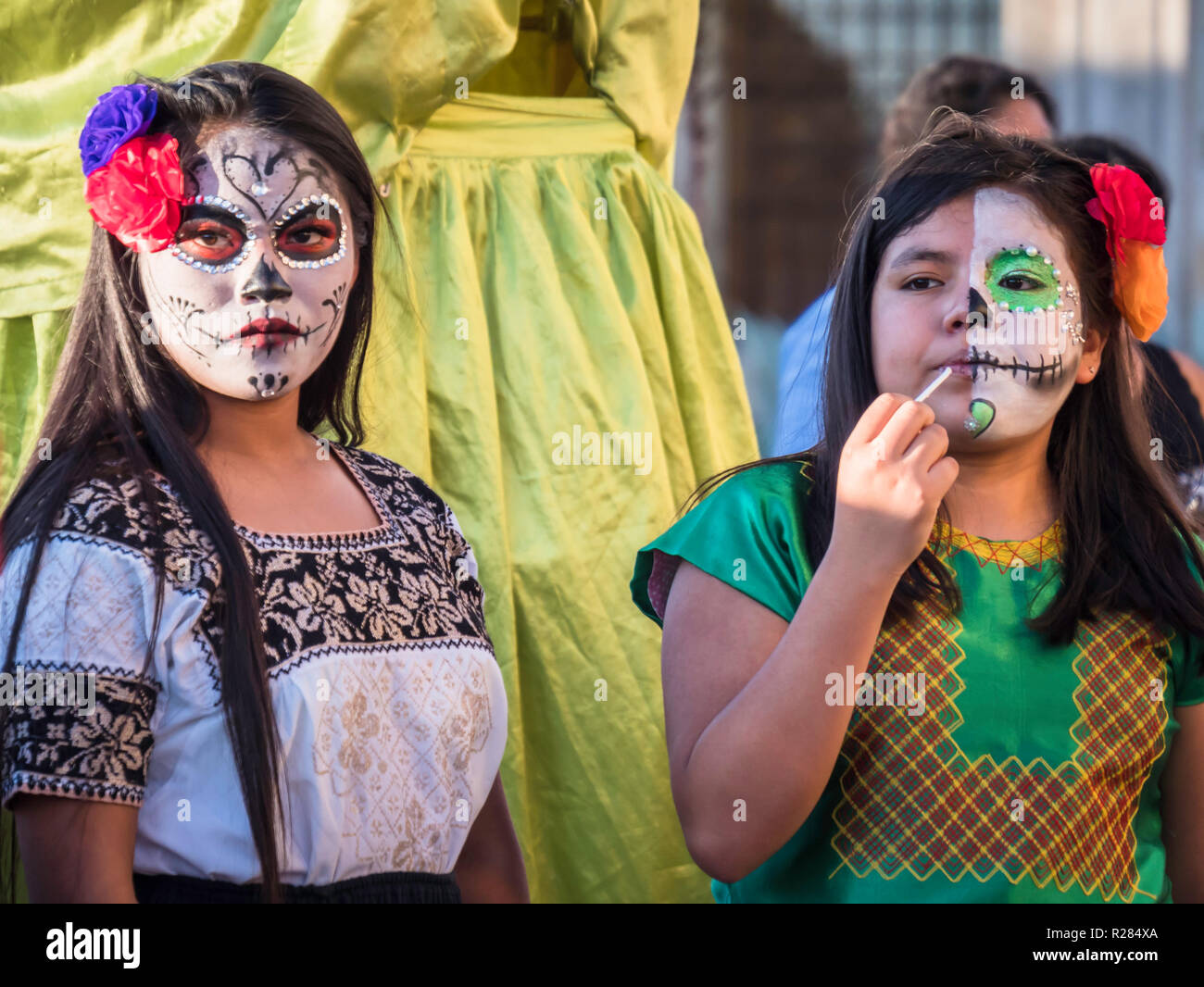 Oaxaca, Mexico - Oct 24 2018: young women with skull make up to celebrate the Day of the Dead Dias de los Muertos in Mexico Stock Photo