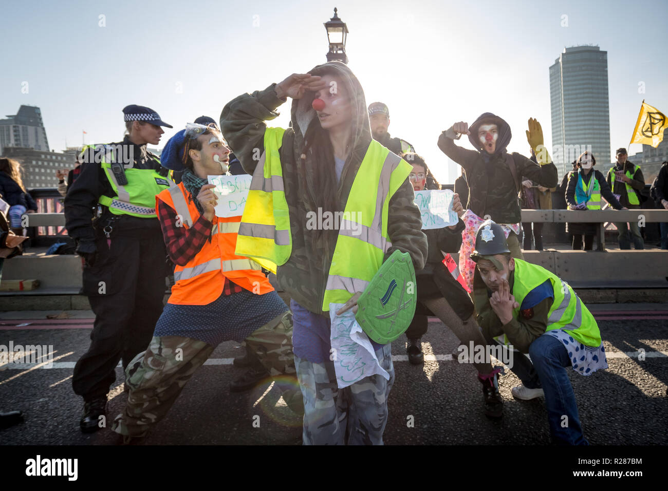 London, UK. 17th November, 2018. Environmental campaigners from Extinction Rebellion block Lambeth Bridge, one of five bridges blocked in central London, as part of a Rebellion Day event to highlight 'criminal inaction in the face of climate change catastrophe and ecological collapse' by the UK Government as part of a programme of civil disobedience during which scores of campaigners have been arrested. Credit: Guy Corbishley/Alamy Live News Stock Photo