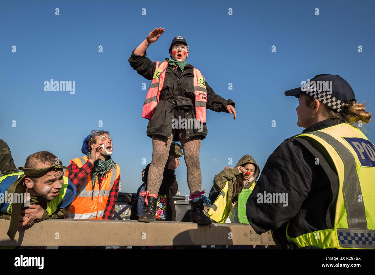 London, UK. 17th November, 2018. Environmental campaigners from Extinction Rebellion block Lambeth Bridge, one of five bridges blocked in central London, as part of a Rebellion Day event to highlight 'criminal inaction in the face of climate change catastrophe and ecological collapse' by the UK Government as part of a programme of civil disobedience during which scores of campaigners have been arrested. Credit: Guy Corbishley/Alamy Live News Stock Photo