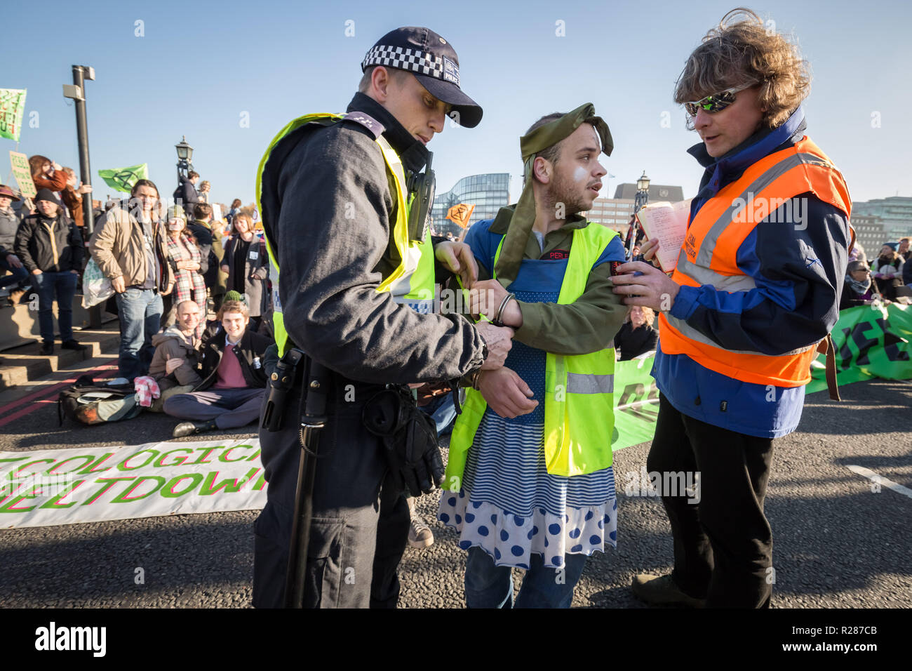London, UK. 17th November, 2018. Environmental campaigners from Extinction Rebellion block Lambeth Bridge, one of five bridges blocked in central London, as part of a Rebellion Day event to highlight 'criminal inaction in the face of climate change catastrophe and ecological collapse' by the UK Government as part of a programme of civil disobedience during which scores of campaigners have been arrested. Credit: Guy Corbishley/Alamy Live News Stock Photo