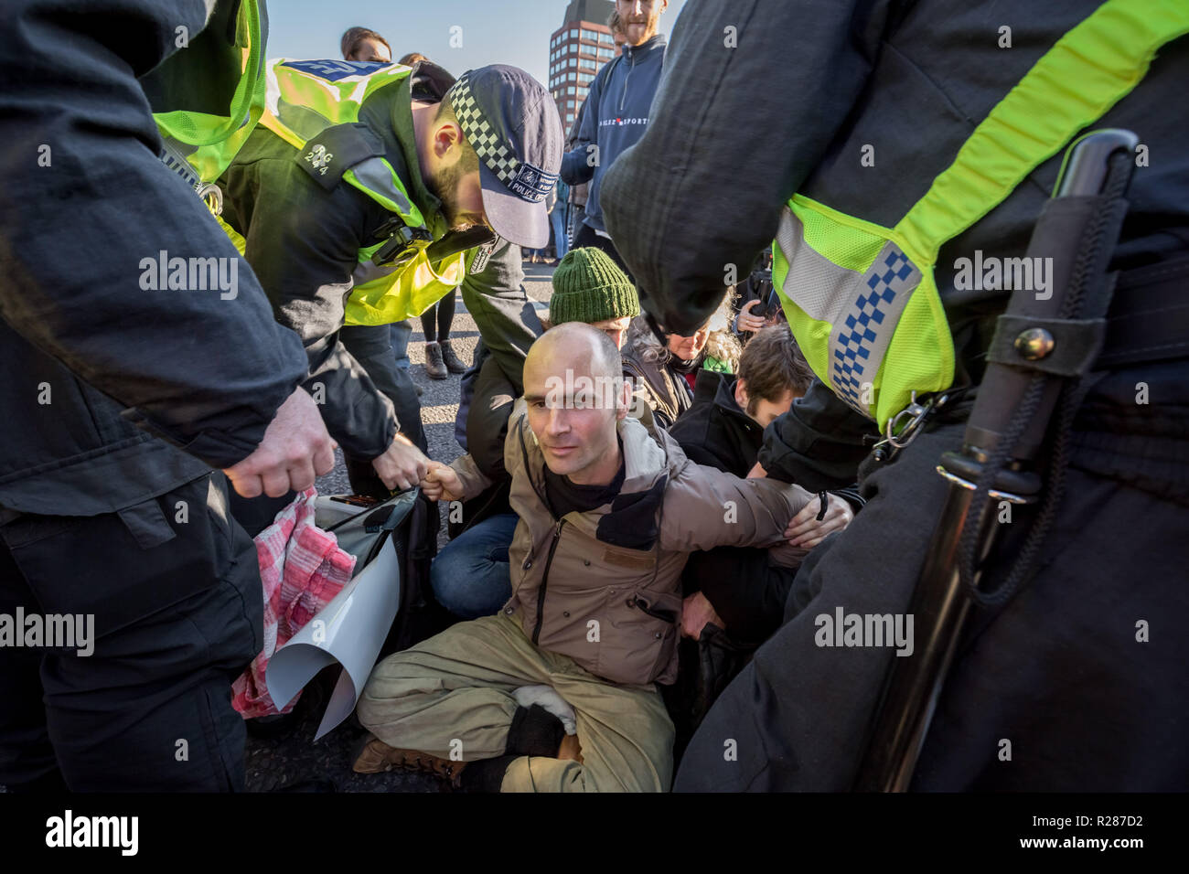 London, UK. 17th November, 2018. Environmental campaigners from Extinction Rebellion block Lambeth Bridge, one of five bridges blocked in central London, as part of a Rebellion Day event to highlight 'criminal inaction in the face of climate change catastrophe and ecological collapse' by the UK Government as part of a programme of civil disobedience during which scores of campaigners have been arrested. Credit: Guy Corbishley/Alamy Live News Stock Photo