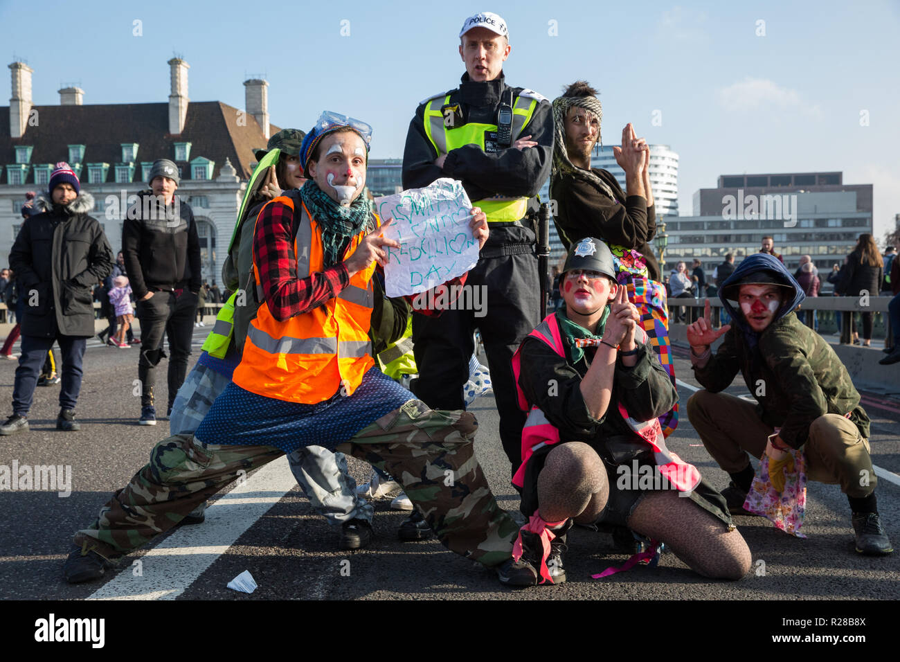London, UK. 17th November, 2018. Clowns from Clandestine Insurgent Rebel Clown Army (CIRCA support environmental campaigners from Extinction Rebellion blocking Westminster Bridge, one of five bridges blocked in central London, as part of a Rebellion Day event to highlight 'criminal inaction in the face of climate change catastrophe and ecological collapse' by the UK Government as part of a programme of civil disobedience during which scores of campaigners have been arrested. Credit: Mark Kerrison/Alamy Live News Stock Photo