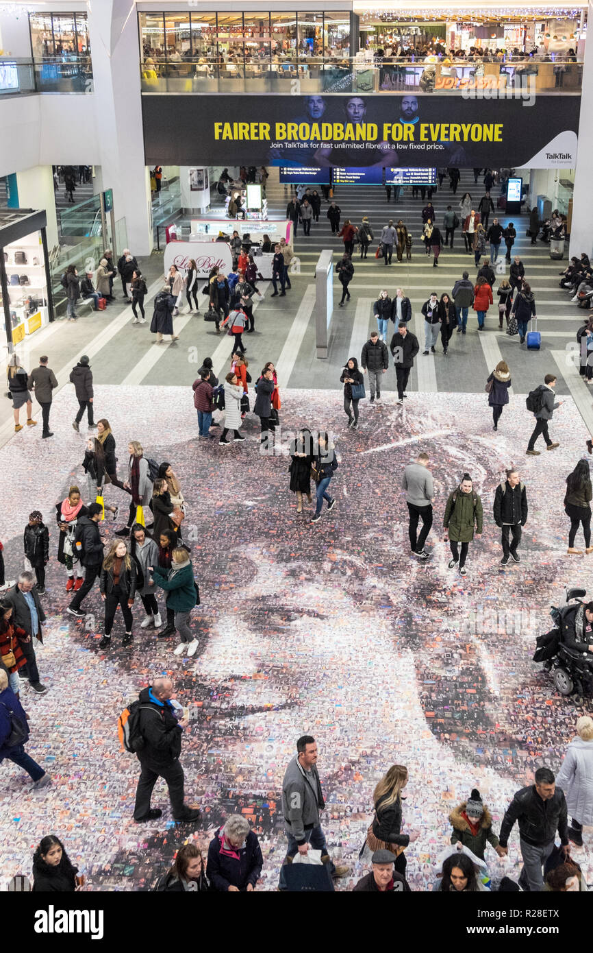 Birmingham, UK. 17th Nov, 2018. Twenty metre portrait of suffragette Hilda Burkitt at New Street Birmingham train station concourse.Artwork by artist Helen Marshall called Face of Suffrage,includes 3,724 photos from the public. Credit: Paul Quayle/Alamy Live News Stock Photo