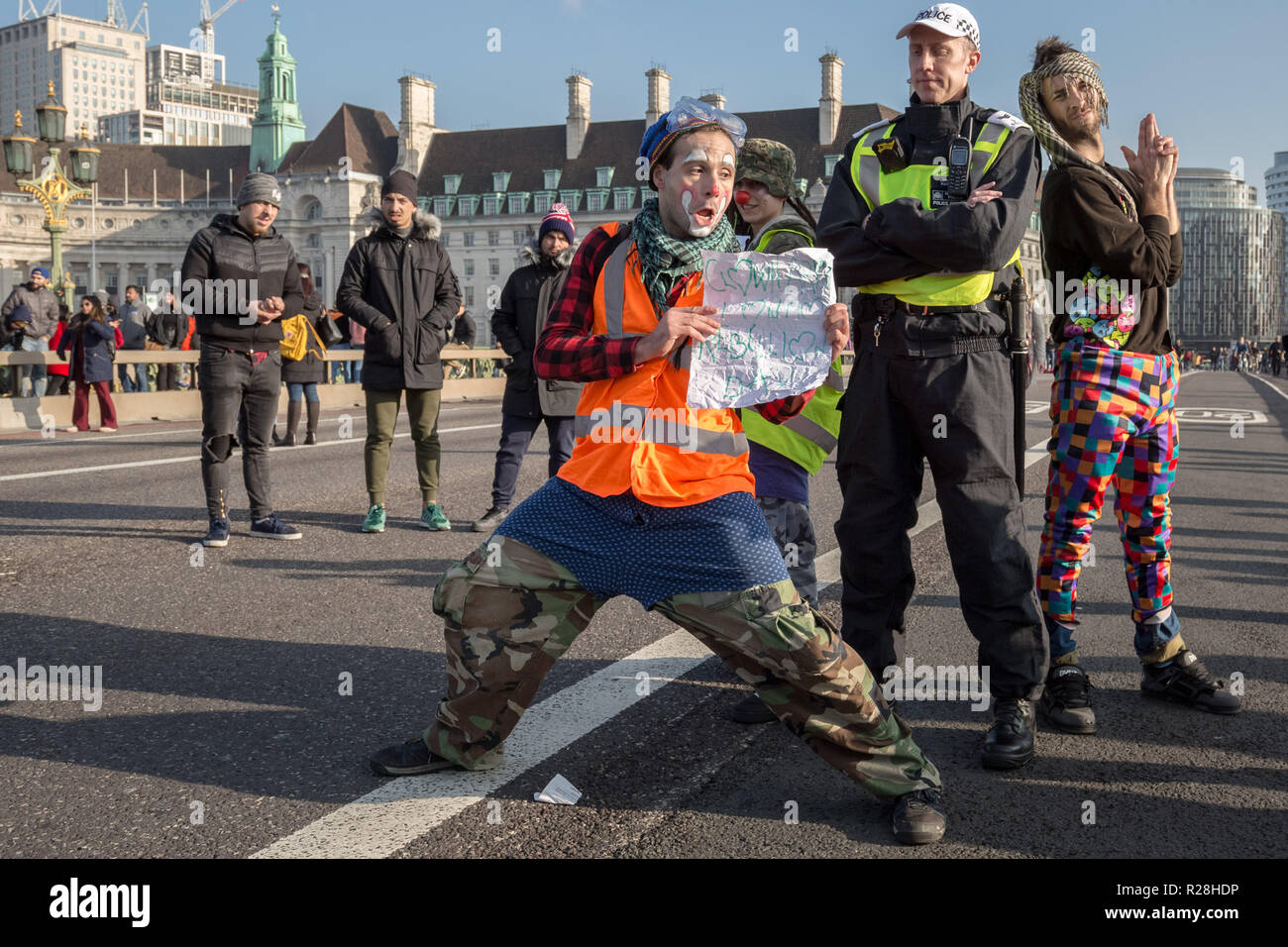 London, UK. 17th November, 2018. Environmental campaigners from Extinction Rebellion block Westminster Bridge, one of five bridges blocked in central London, as part of a Rebellion Day event to highlight 'criminal inaction in the face of climate change catastrophe and ecological collapse' by the UK Government as part of a programme of civil disobedience during which scores of campaigners have been arrested. Credit: Guy Corbishley/Alamy Live News Stock Photo