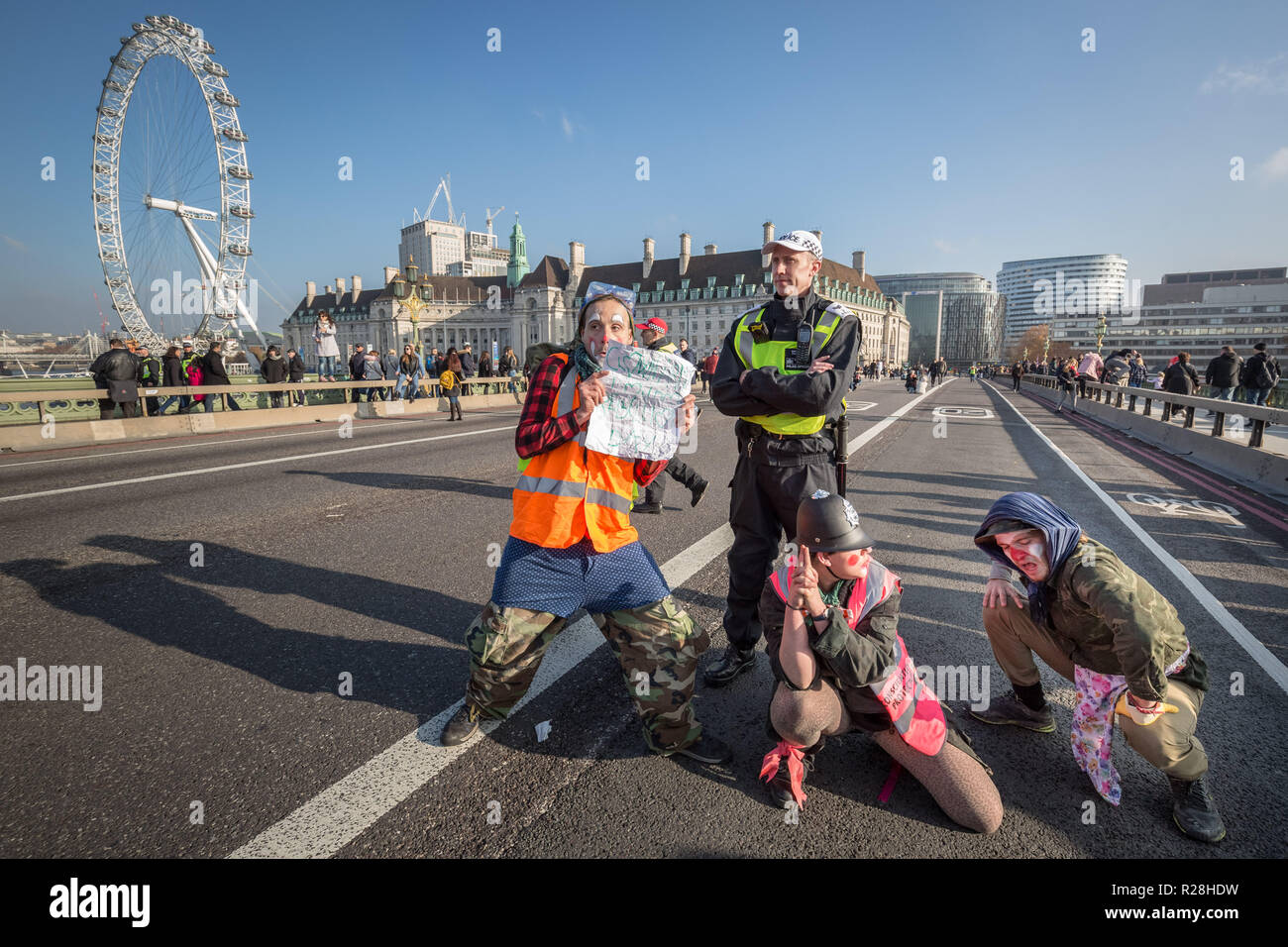 London, UK. 17th November, 2018. Environmental campaigners from Extinction Rebellion block Westminster Bridge, one of five bridges blocked in central London, as part of a Rebellion Day event to highlight 'criminal inaction in the face of climate change catastrophe and ecological collapse' by the UK Government as part of a programme of civil disobedience during which scores of campaigners have been arrested. Credit: Guy Corbishley/Alamy Live News Stock Photo